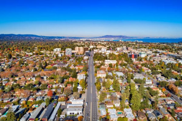 Aerial of the city of San Mateo, with the San Francisco Bay and the city of San Francisco in the distance, during autumn.